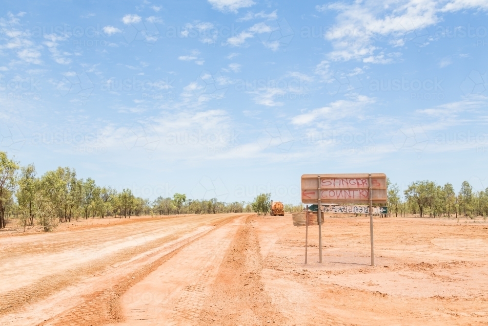 Graffiti on road sign in the outback , Savannah Way - Australian Stock Image