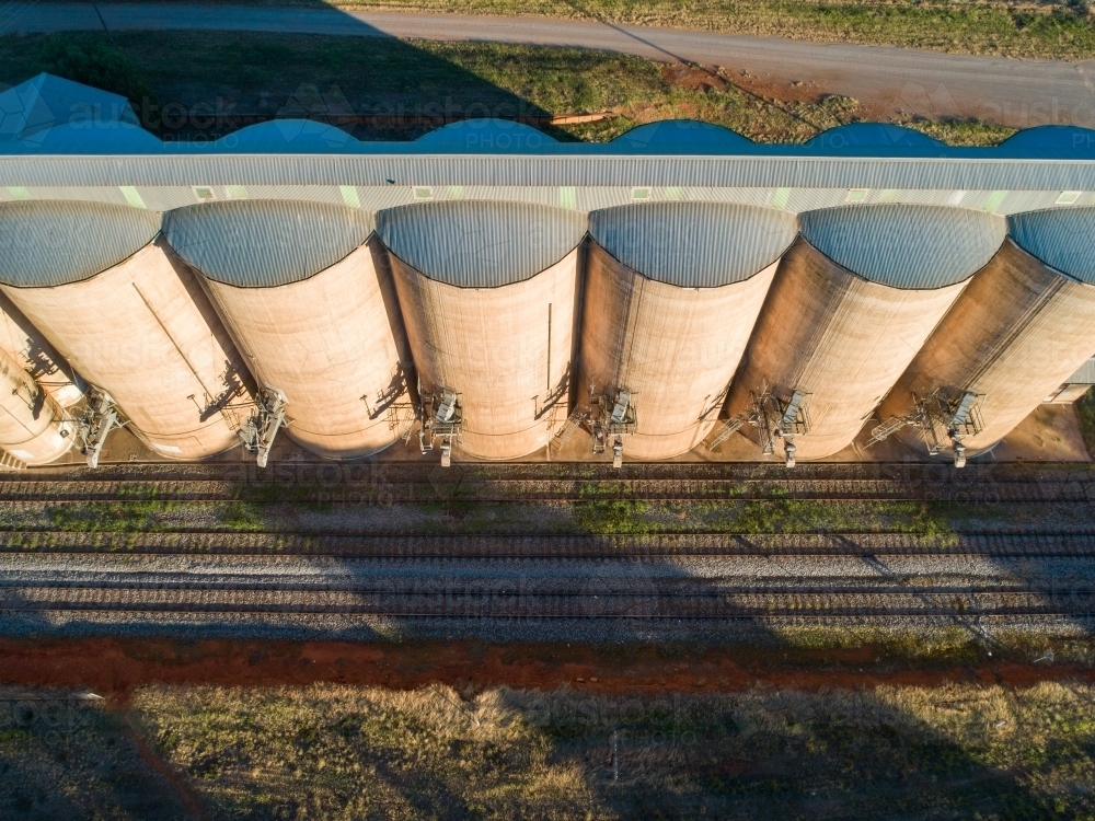 Grain silos on a railway track in the country - Australian Stock Image