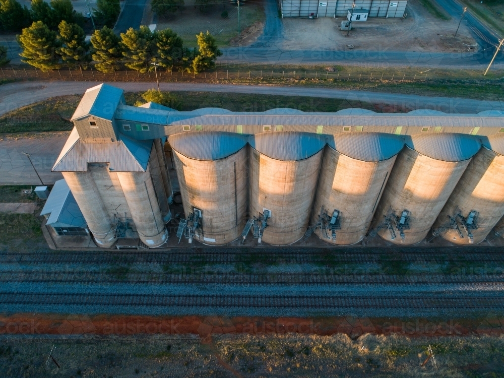 Grain silos on a railway track in the country - Australian Stock Image