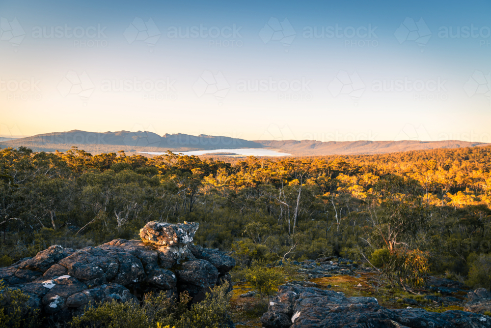 Grampians mountains landscape with native trees viewed towards Wartook Reservoir at sunset, Victoria - Australian Stock Image