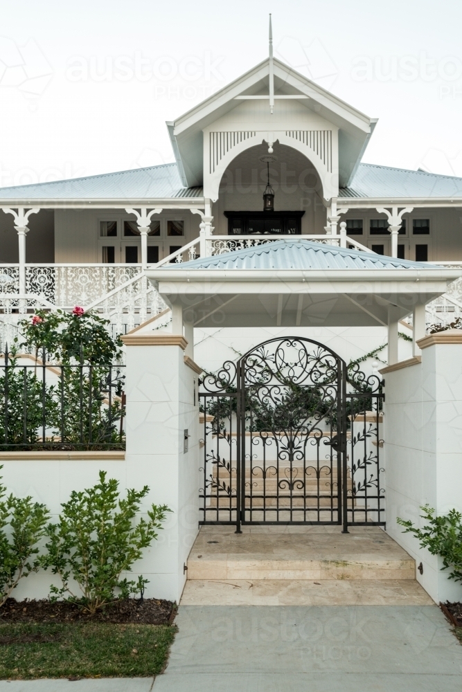 Grand Queenslander home with large front gate - Australian Stock Image
