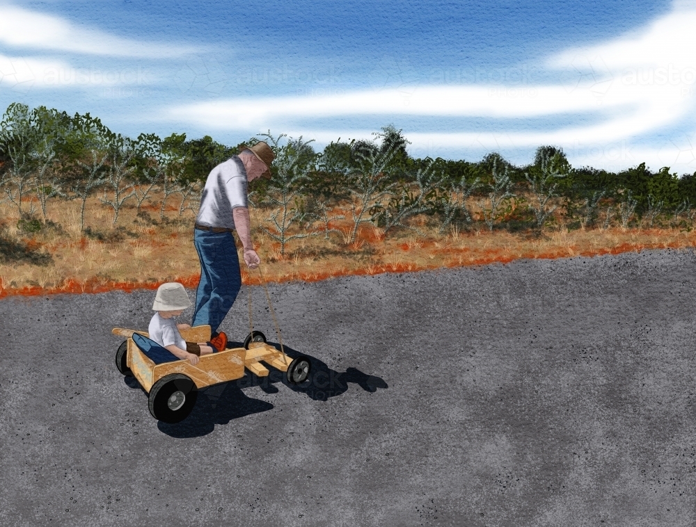 Grandfather with grandson on billy cart ride on quiet country road in Australia - Australian Stock Image