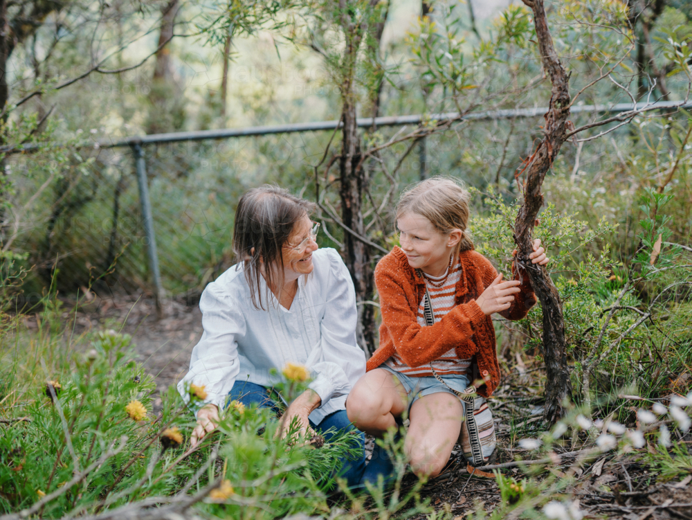 Grandmother showing young granddaughter Australian Natives - Australian Stock Image