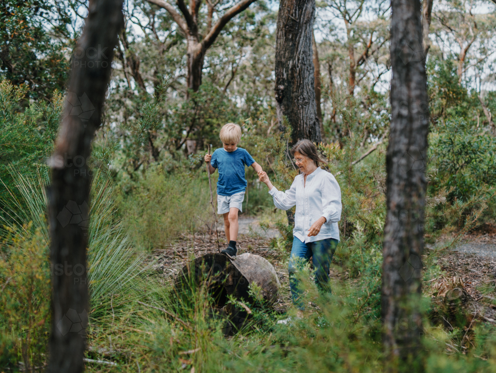 Grandmother spending time with grandson in nature exploring the bush - Australian Stock Image