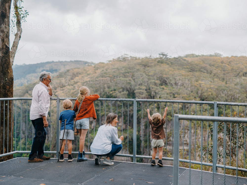 Grandparents enjoying Australian Bushland with their Grandchildren standing at lookout - Australian Stock Image