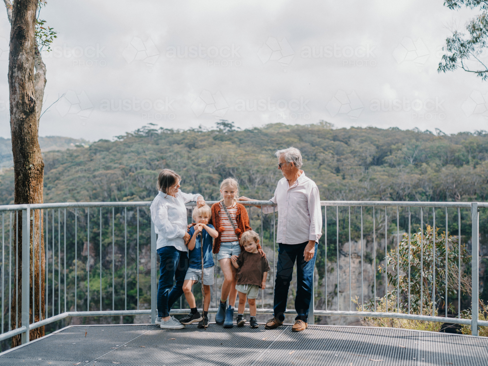 Grandparents enjoying Australian Bushland with their Grandchildren standing at lookout - Australian Stock Image
