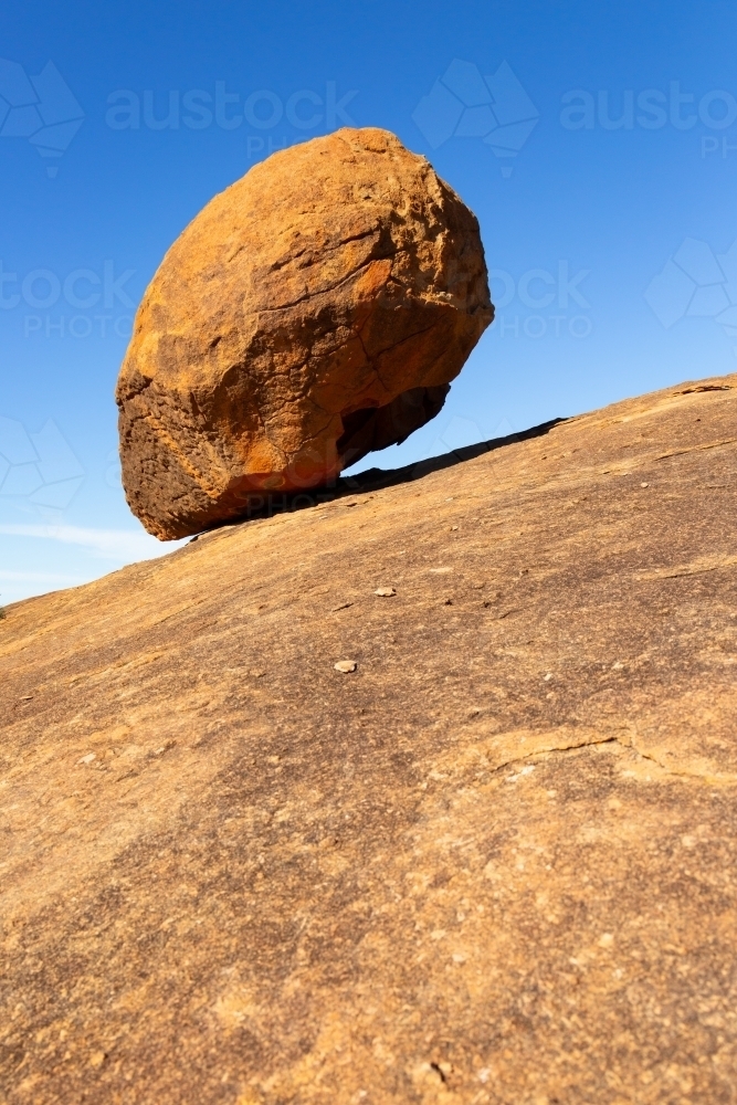 granite boulder balancing on rock at Berringbooding - Australian Stock Image