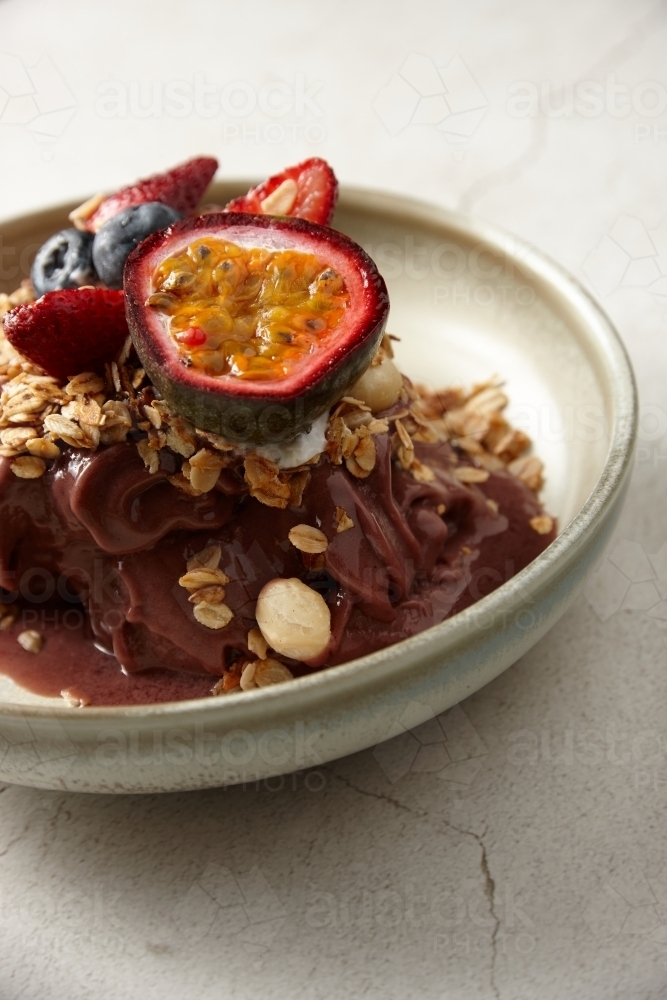 Granola cereal with fruit in bowl - Australian Stock Image