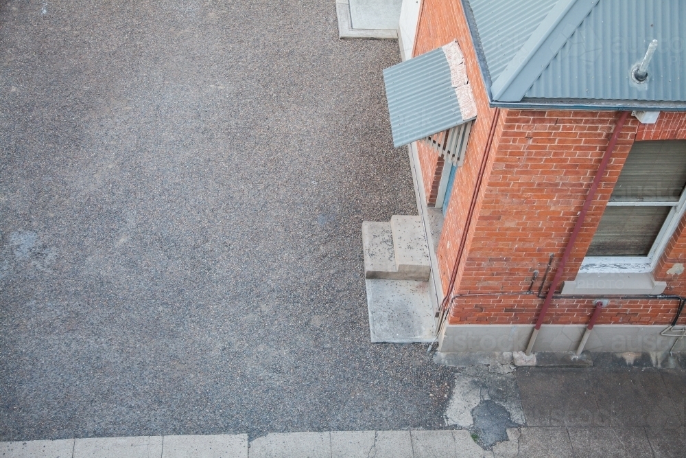 Gravel copy space and back door of a building - Australian Stock Image