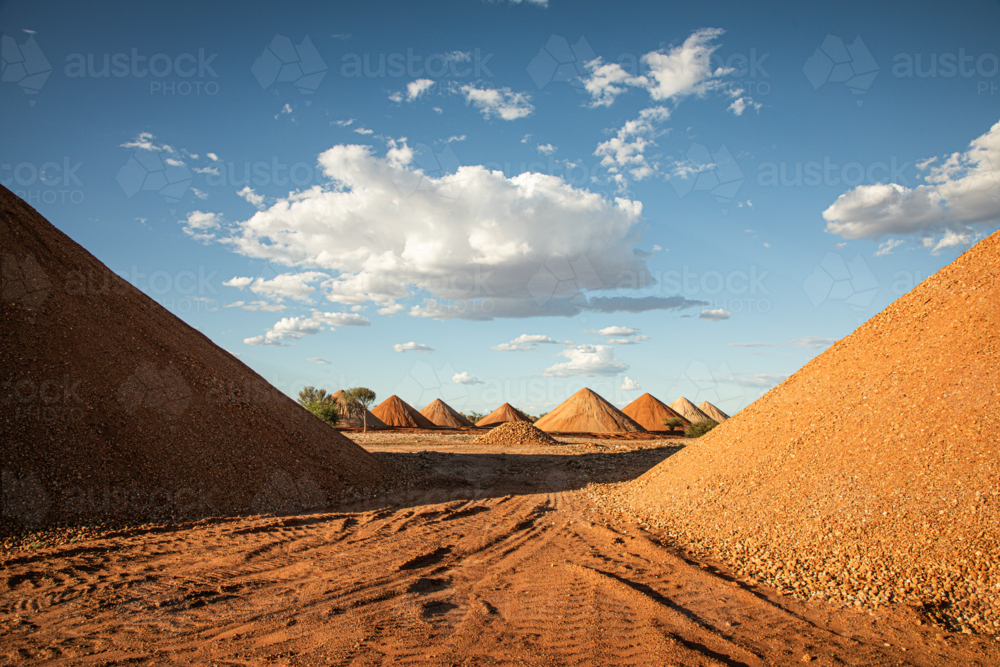Gravel piles for building road base post flood damage - Australian Stock Image