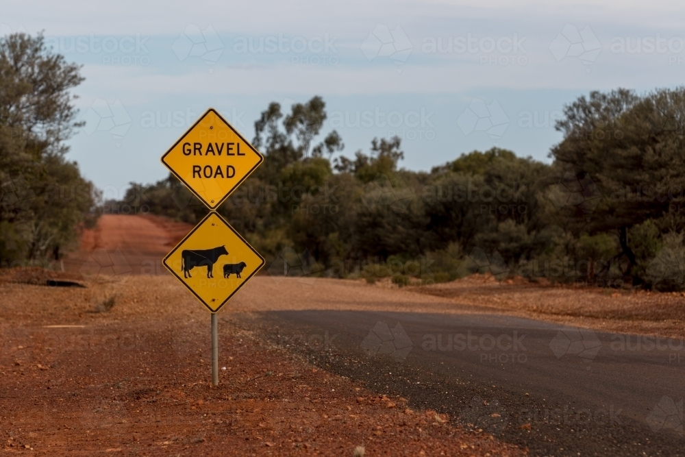 Gravel road sign on side of unsealed road - Australian Stock Image