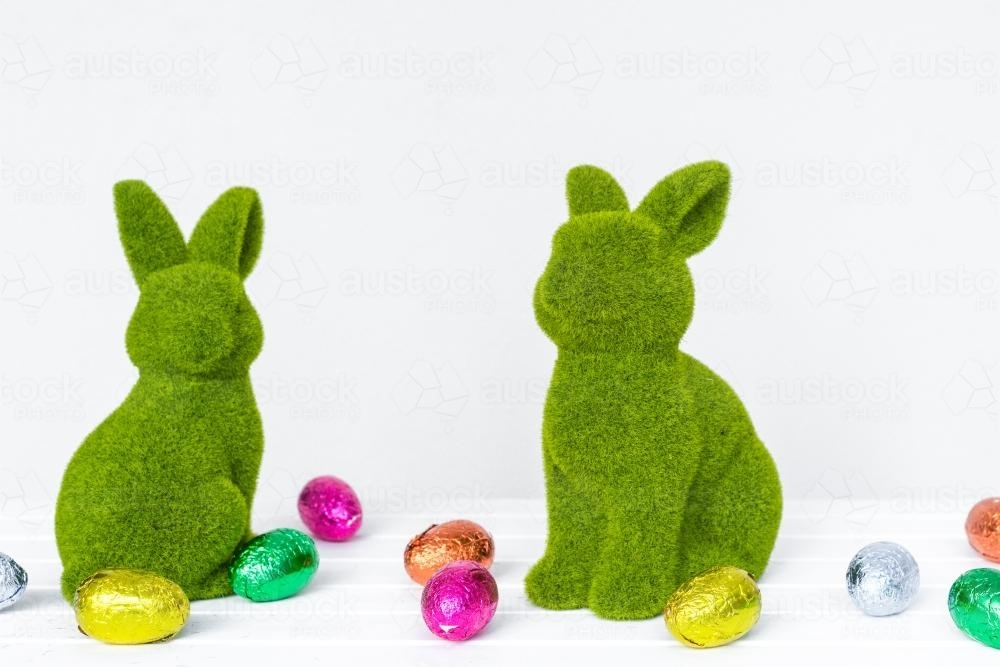Green bunnies with colourful easter eggs - Australian Stock Image