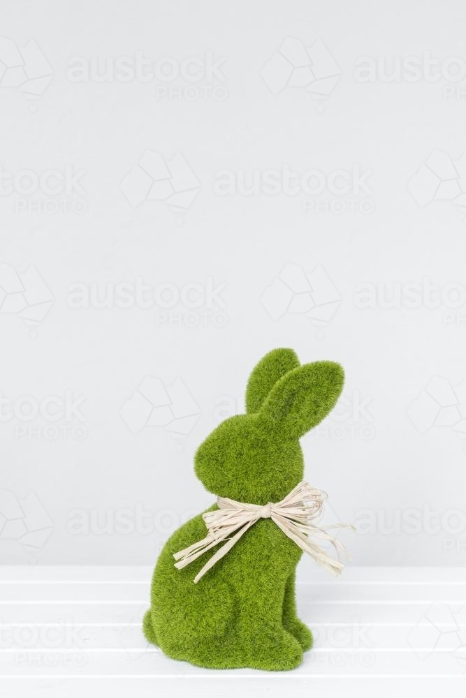 Green easter bunny against a plain background - Australian Stock Image