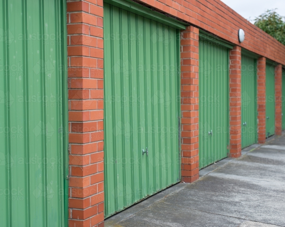 Green garage doors and red bricks - Australian Stock Image