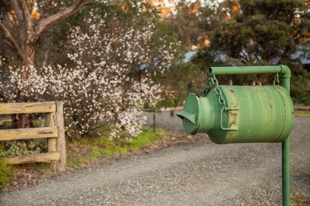 Green milk can mailbox outside a rural home - Australian Stock Image