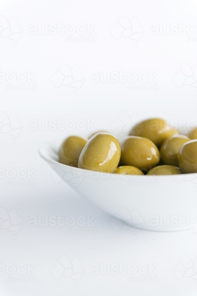 Green Olives In A Bowl on White - Australian Stock Image