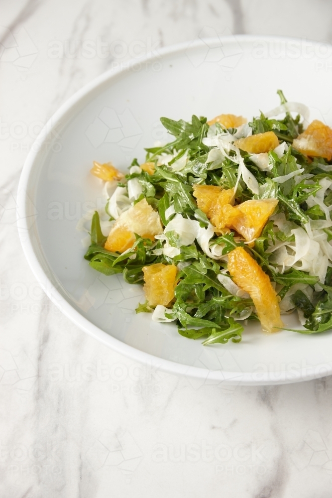 green salad with orange slices and grated cheese - Australian Stock Image