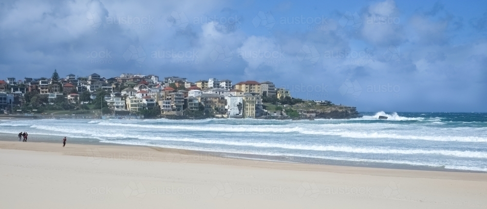 grey clouds hanging over Bondi beach on a quiet but windy day - Australian Stock Image
