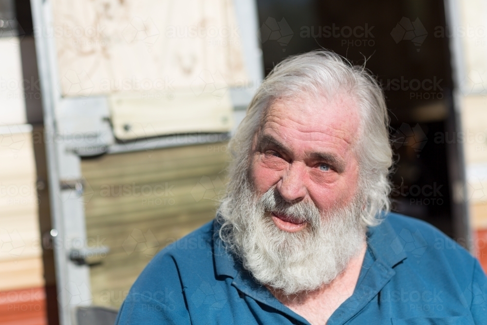 Grey haired old bloke looking at camera - Australian Stock Image