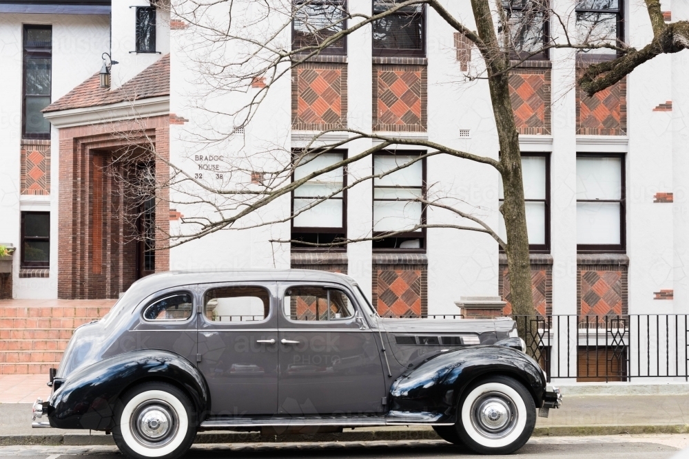 Grey vintage car parked in an inner city street - Australian Stock Image