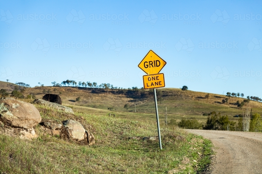 Grid, One Lane sign on gravel rural road - Australian Stock Image