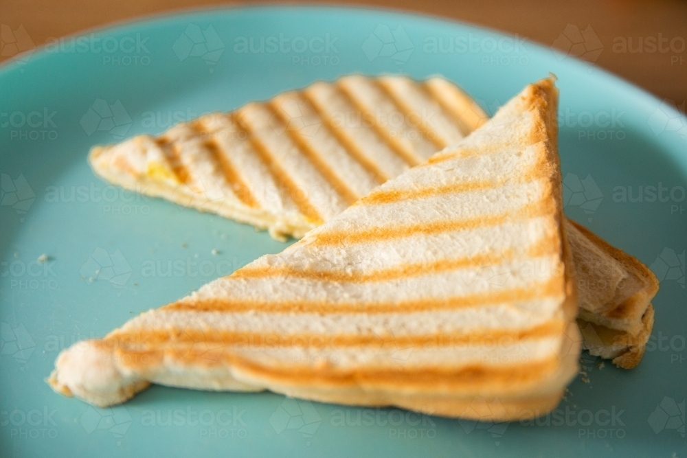 grilled cheese sandwich cut into triangles - Australian Stock Image