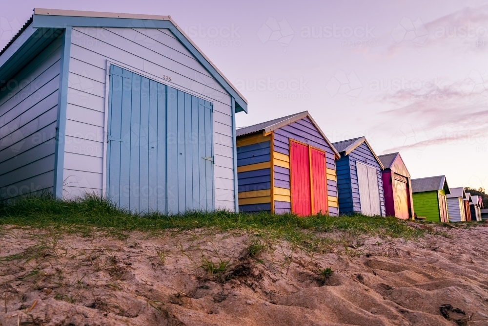 Ground level view of a row of colorful timber bathing boxes - Australian Stock Image