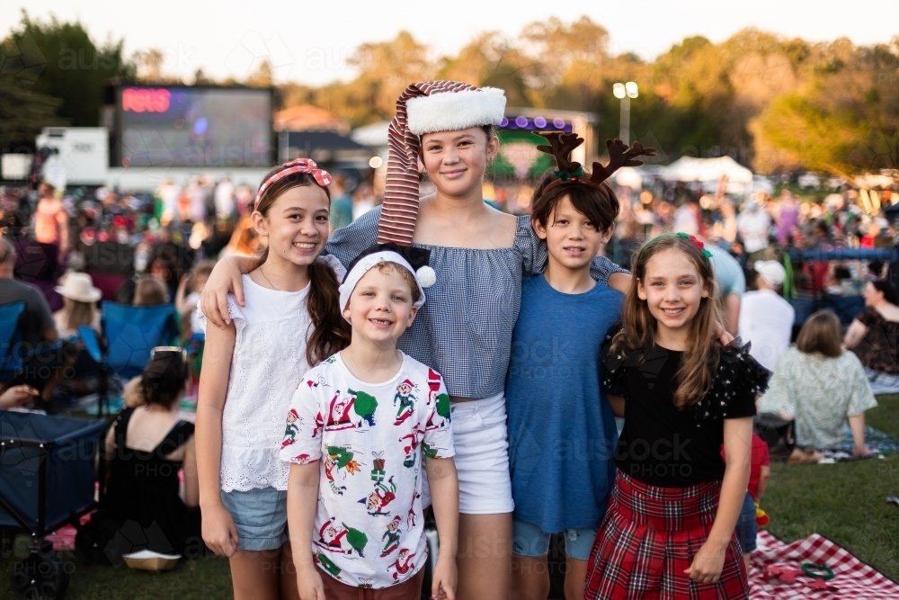 group of 5 children at the Christmas carols - Australian Stock Image