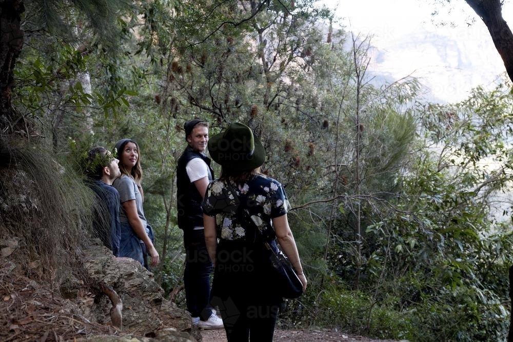 Group of friends on bush walk looking at scenery - Australian Stock Image