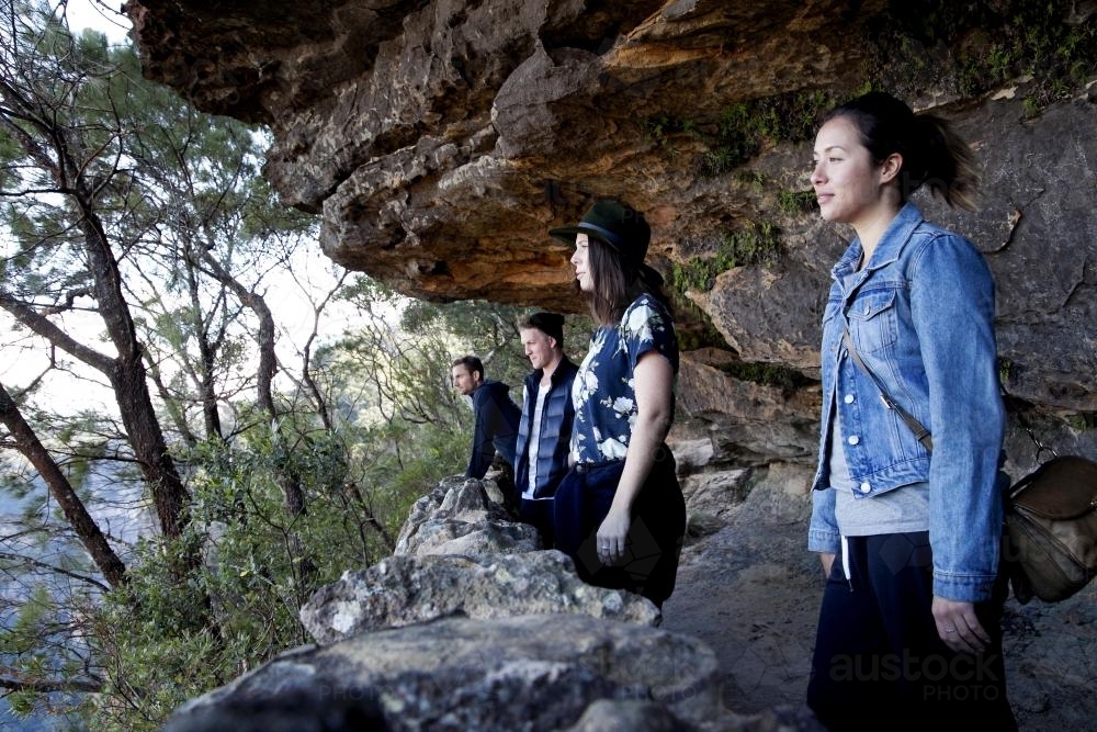 Group of friends on bush walk looking at scenery - Australian Stock Image