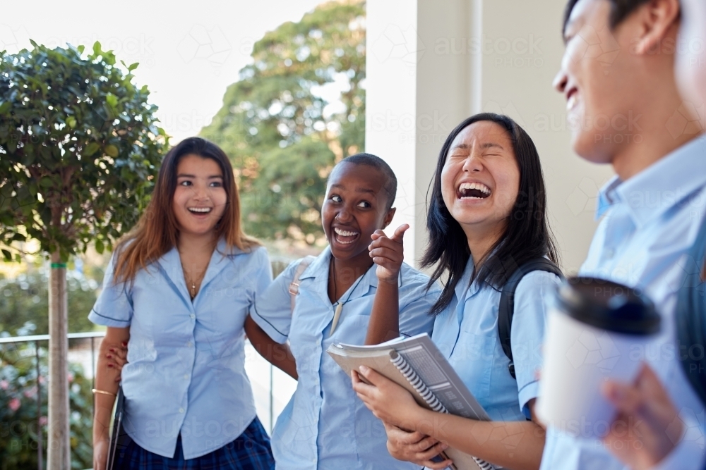 Group of High School students laughing together - Australian Stock Image
