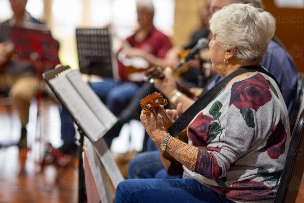 group of seniors playing musical instruments - Australian Stock Image