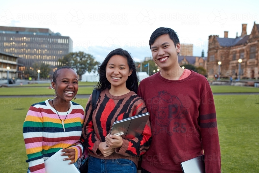 Group of young university students hanging out on-campus - Australian Stock Image