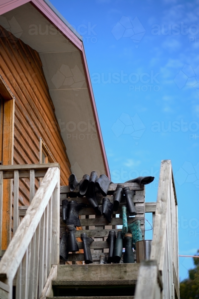 Gumboots Hanging on Stairway Rails - Australian Stock Image