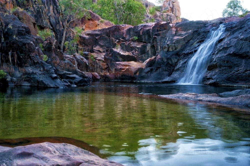 Gunlom Kakadu watering hole with waterfall - Australian Stock Image