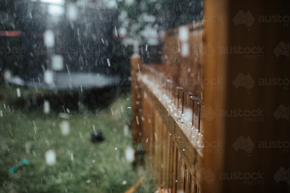 Hail and rain in a backyard - Australian Stock Image