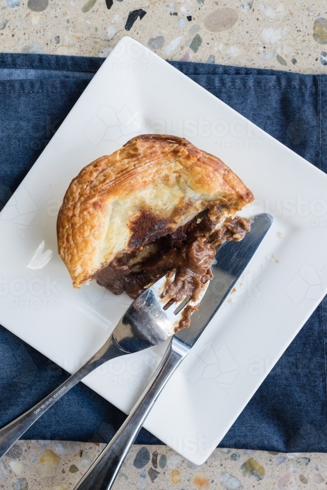 halfway through a meat pie - Australian Stock Image