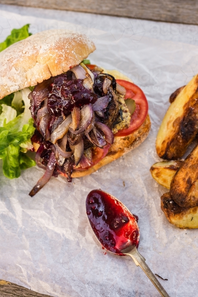 hamburger with potato wedges and beetroot relish - Australian Stock Image