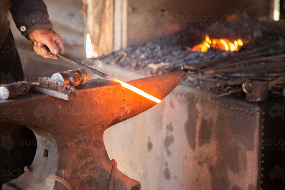 Hammer and anvil beside forge in blacksmith at Tocal - Australian Stock Image