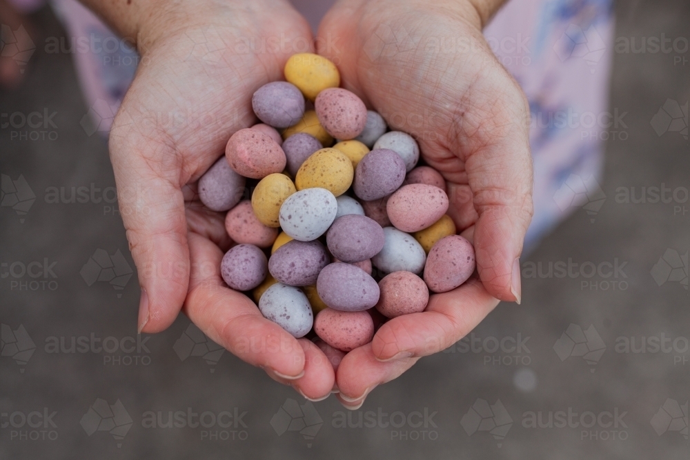 Handful of pastel speckled chocolate easter eggs - Australian Stock Image