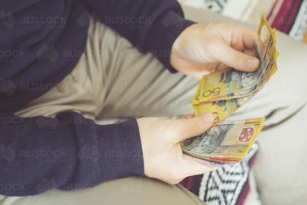 Hands Counting Australian Money - Australian Stock Image