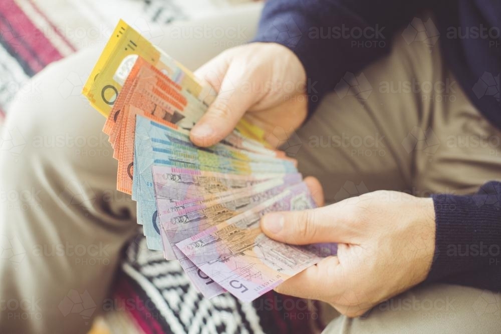 Hands Holding Australian Currency - Australian Stock Image