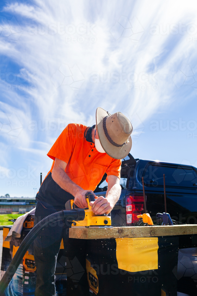hands on planer tool demonstration during class for teenaged trade apprentices - Australian Stock Image