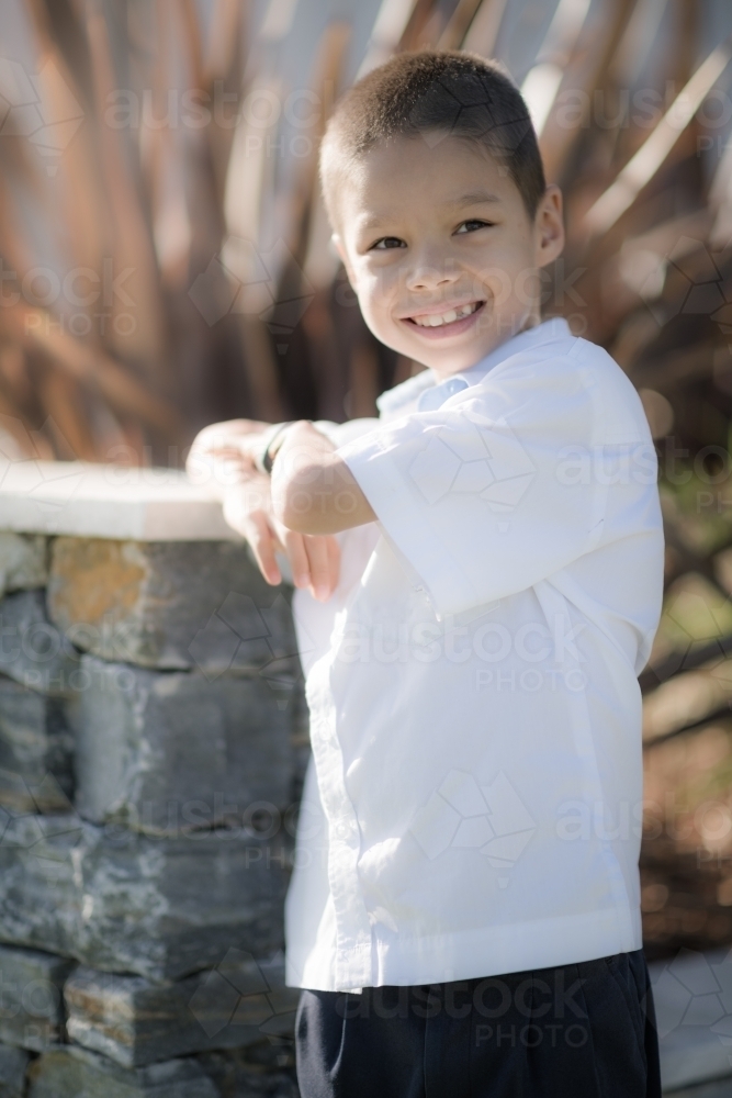 Handsome boys in school uniform leave home for their first day of school - Australian Stock Image