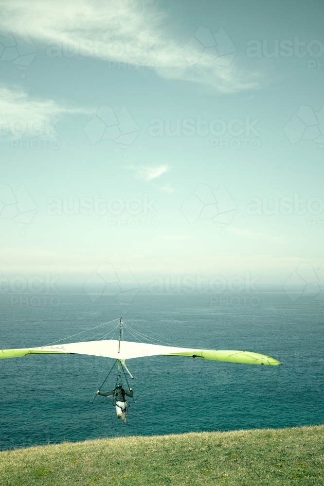 Hang glider taking off to the horizon on a beautiful day - Australian Stock Image