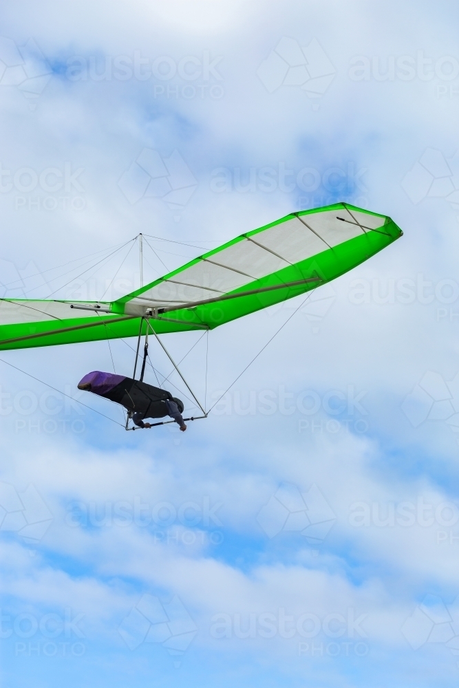 hang gliding person flying in sky - Australian Stock Image