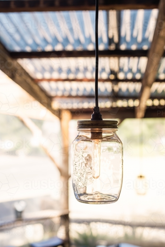 hanging light in a glass jar - Australian Stock Image