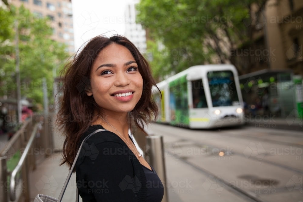 Happy Asian Woman Crossing Collins Street Melbourne - Australian Stock Image