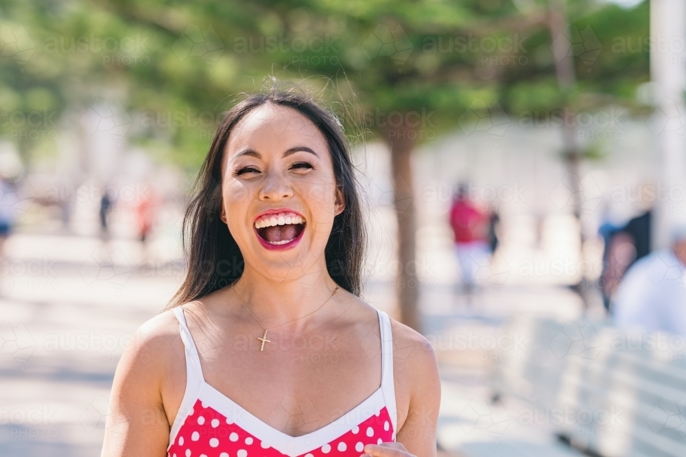 happy asian woman in bikini - Australian Stock Image