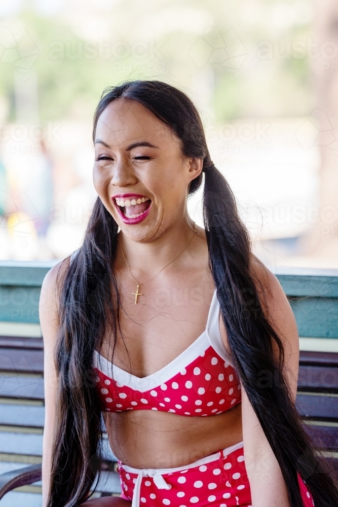 happy asian woman in bikini - Australian Stock Image